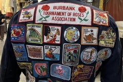The back of Erik’s overalls with the patches of the floats he has worked on.