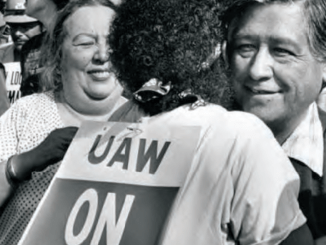 Terry Moore hugs United Farm Workers leader Cesar Chavez at the UAW rally in 1984 against Douglas aircraft at Long Beach Park (Wardlow Park). PHOTO: LOS ANGELES PUBLIC LIBRARY