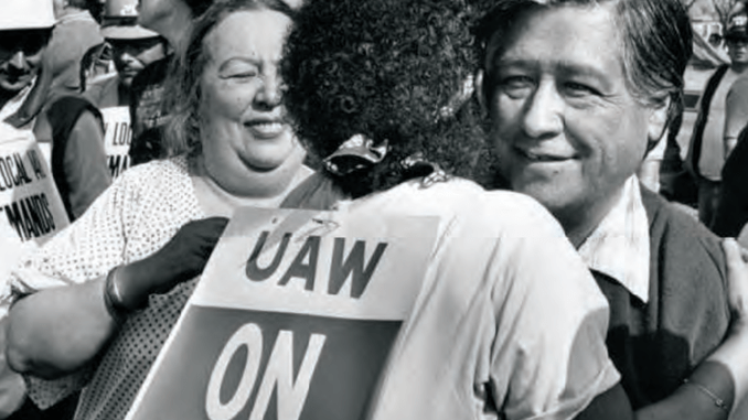 Terry Moore hugs United Farm Workers leader Cesar Chavez at the UAW rally in 1984 against Douglas aircraft at Long Beach Park (Wardlow Park). PHOTO: LOS ANGELES PUBLIC LIBRARY