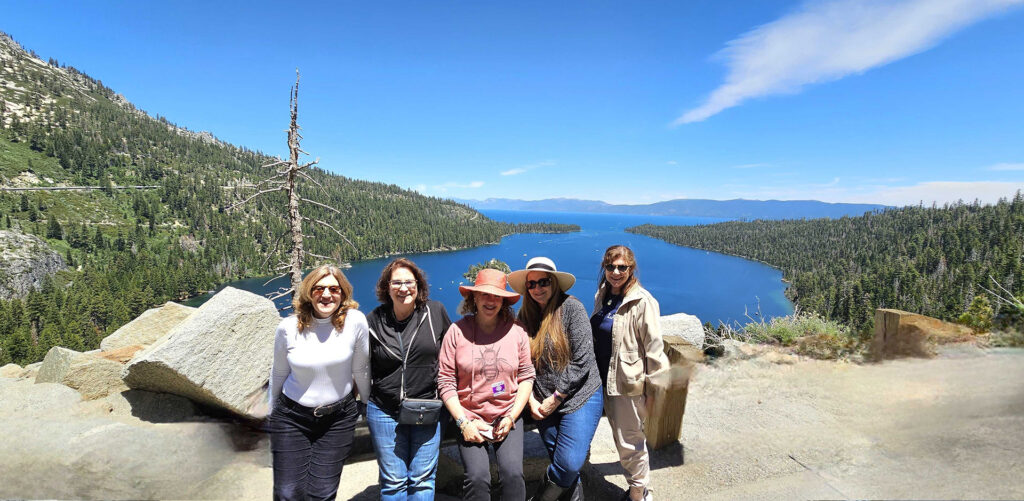 Holly Sklar, left, Nancy Morrison, Eliza Cohen, Sharon Smith Holley and Nancy Frazen on a hike by the lake.
